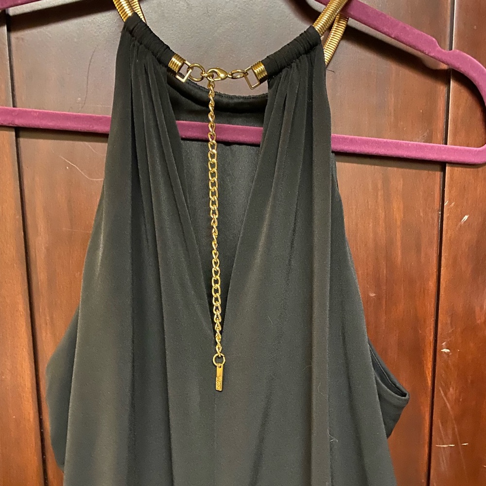 Black halter dress with gold necklace